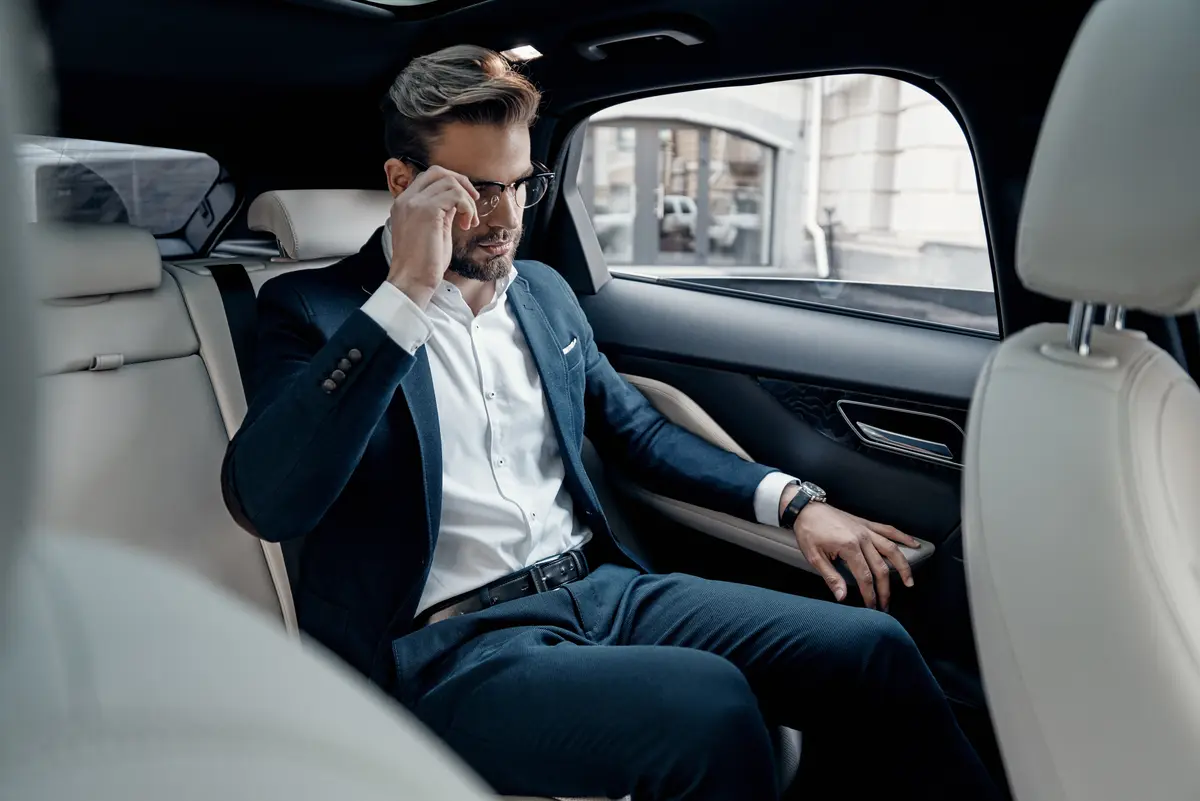 Man is sitting in a limo
